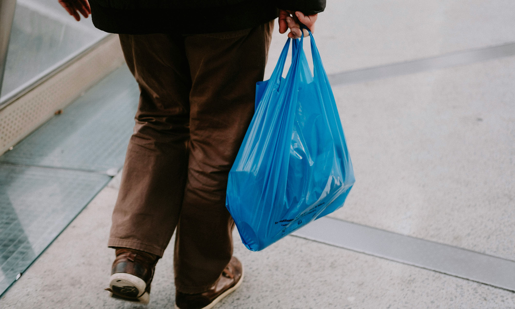 Person walking through neighborhood running everyday errands