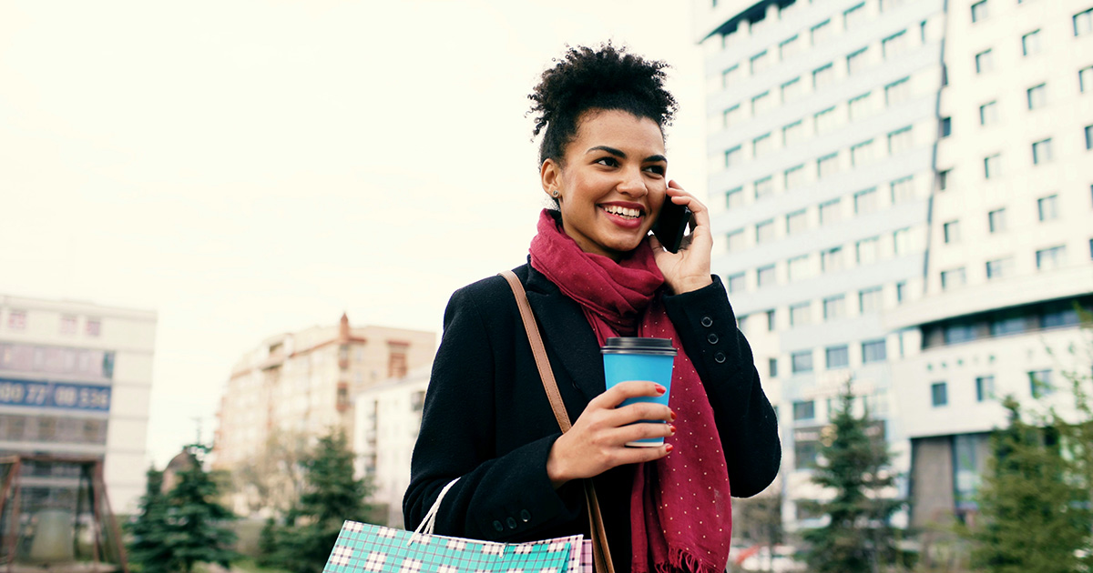 Woman walking casually talking on the phone.
